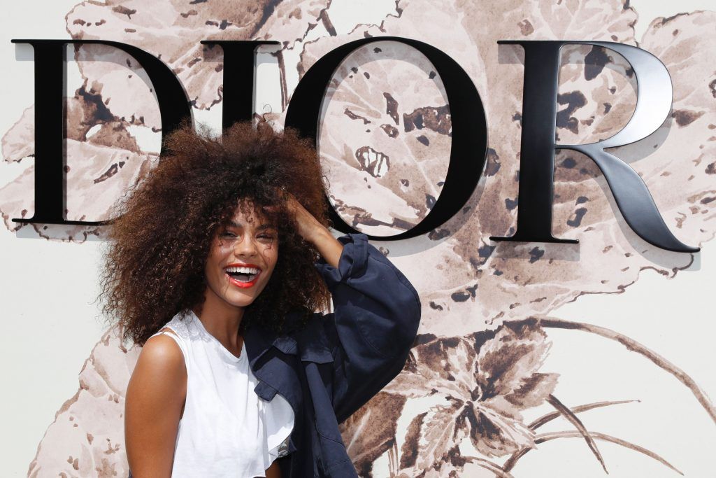 Italian model Tina Kunakey poses during the photocall before Christian Dior 2017 fall/winter Haute Couture collection show in Paris on July 3, 2017. (Photo by Patrick Kovarik/AFP/Getty Images)