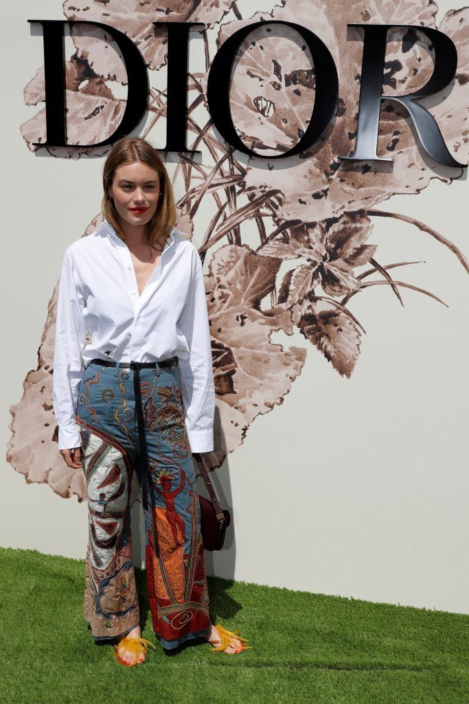 French-US model Camille Rowe poses during the photocall before Christian Dior 2017 fall/winter Haute Couture collection show in Paris on July 3, 2017. (Photo by Patrick Kovarik/AFP/Getty Images)