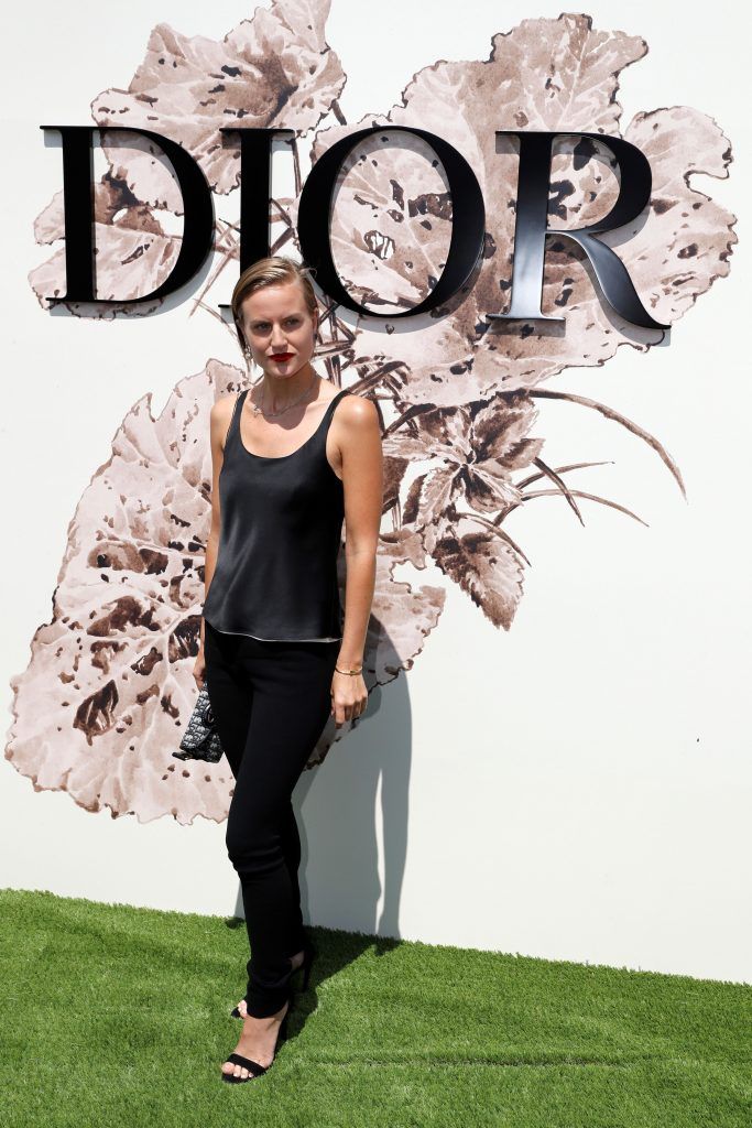 Olympia Scarry poses during the photocall before Christian Dior 2017 fall/winter Haute Couture collection show in Paris on July 3, 2017. (Photo by Patrick Kovarik/AFP/Getty Images)