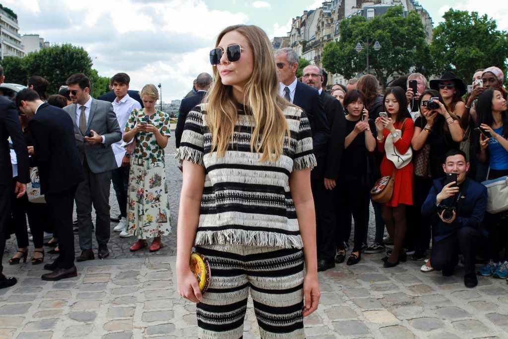 US actress Elizabeth Olsen arrives before Christian Dior 2017 fall/winter Haute Couture collection show in Paris on July 3, 2017. (Photo by AFP/Getty Images)