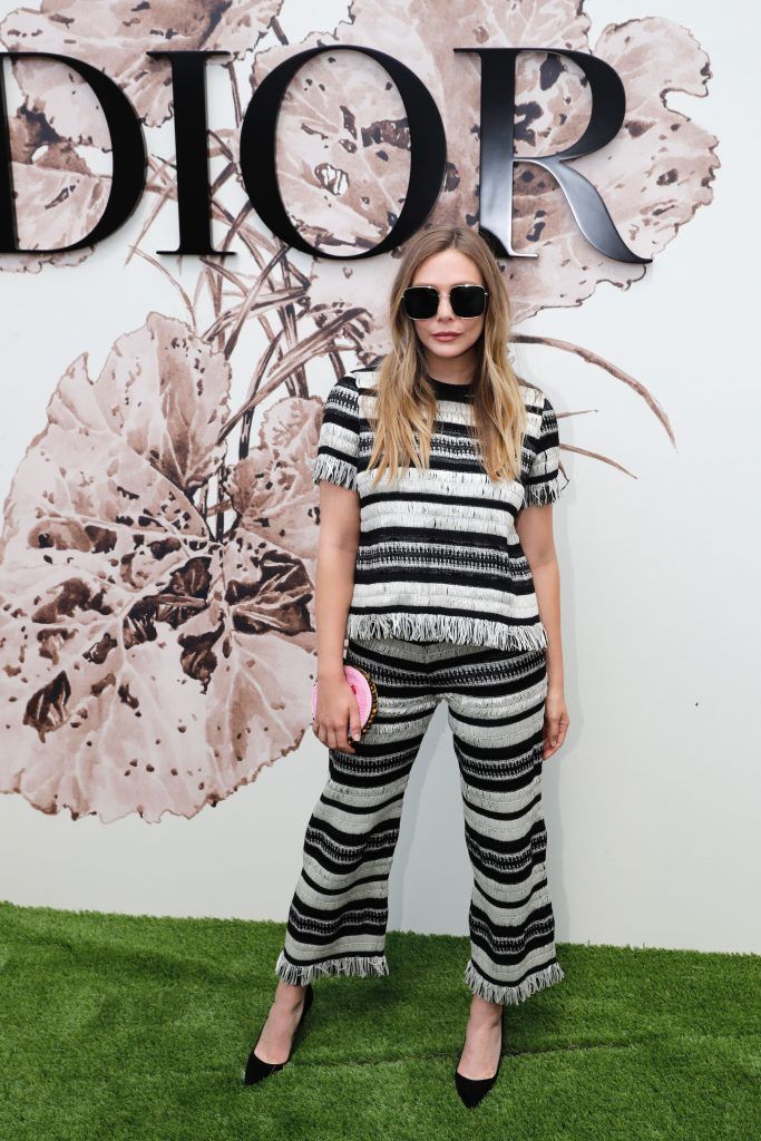 US actress Elizabeth Olsen poses during the photocall before Christian Dior 2017 fall/winter Haute Couture collection show in Paris on July 3, 2017. (Photo by PATRICK KOVARIK/AFP/Getty Images)