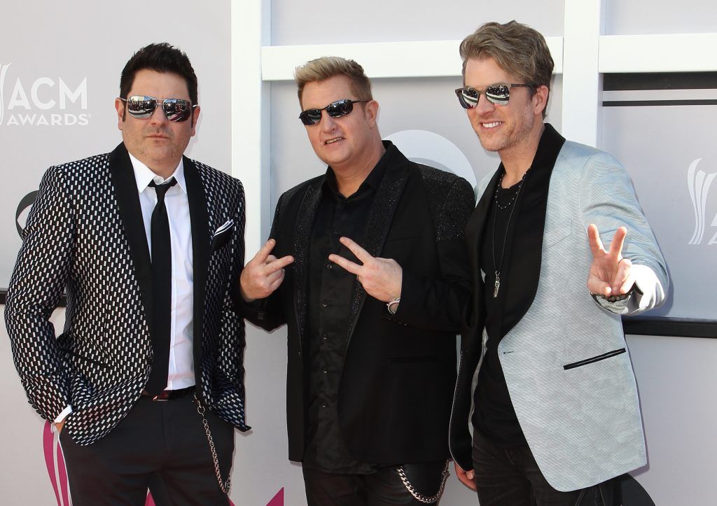 (L-R) Recording artists Jay DeMarcus, Gary LeVox and Joe Don Rooney of Rascal Flatts arrive for the 52nd Academy of Country Music Awards on April 2, 2017, at the T-Mobile Arena in Las Vegas, Nevada. (Photo TOMMASO BODDI/AFP/Getty Images)