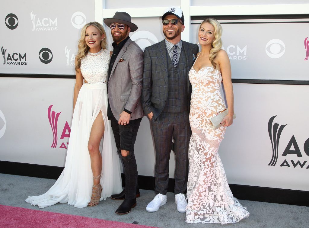 Preston Brust and Chris Lucas of duo LOCASH arrive with  Kristen White (L) and Kaitlyn Lucas (R) for the 52nd Academy of Country Music Awards on April 2, 2017, at the T-Mobile Arena in Las Vegas, Nevada.  (Photo TOMMASO BODDI/AFP/Getty Images)