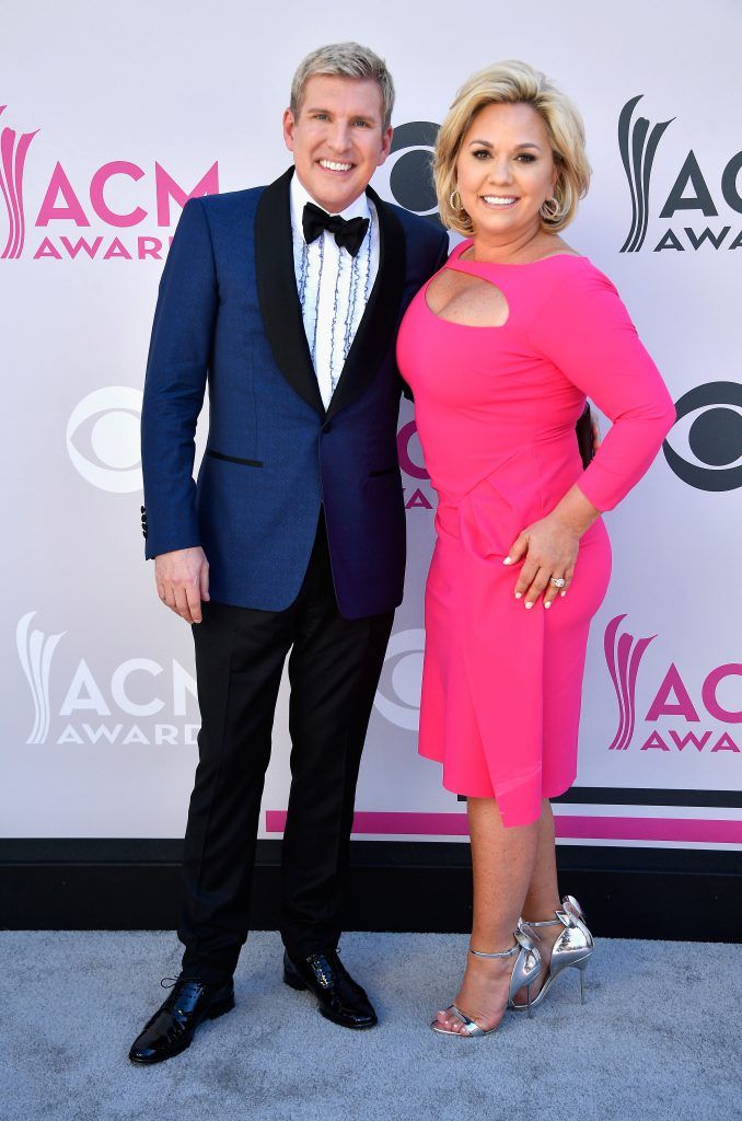 TV personalities Todd Chrisley (L) and Julie Chrisley attend the 52nd Academy Of Country Music Awards at Toshiba Plaza on April 2, 2017 in Las Vegas, Nevada.  (Photo by Frazer Harrison/Getty Images)