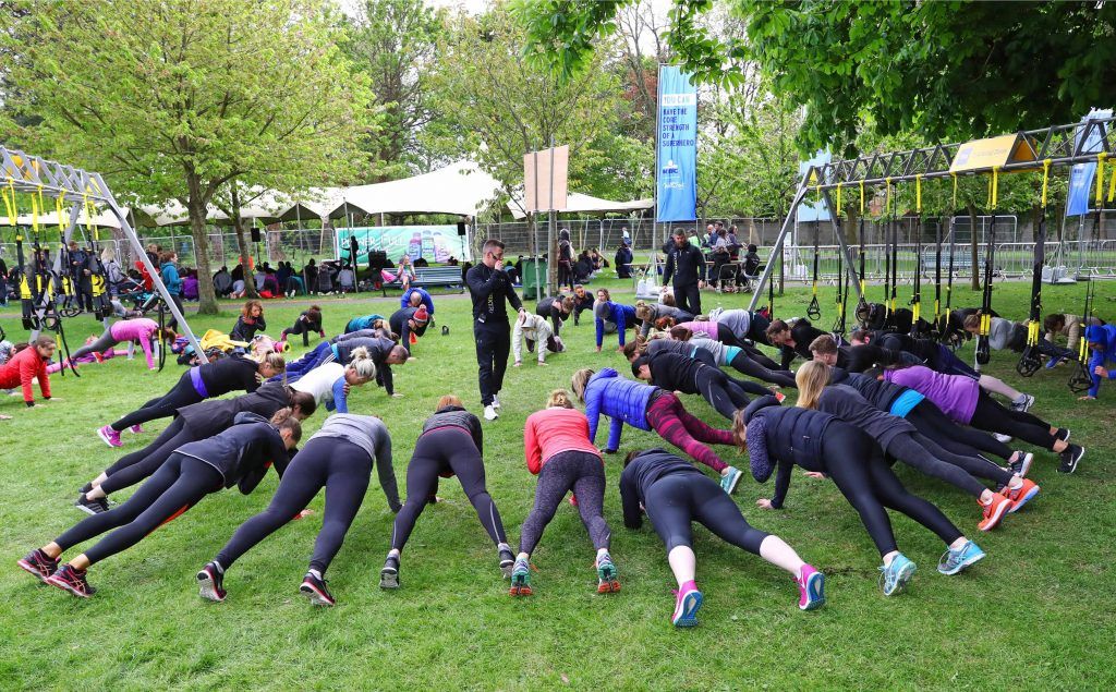 Warming up as over 5,000 people descended on Dublin's Herbert park for WellFest, Ireland's only health, wellness and fitness festival. Pic: Marc O'Sullivan