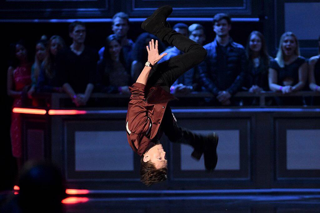 Tom Holland flips onstage during the 2017 MTV Movie And TV Awards at The Shrine Auditorium on May 7, 2017 in Los Angeles, California.  (Photo by Kevork Djansezian/Getty Images)