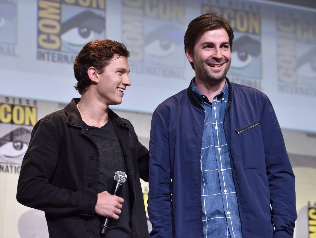 Tom Holland (L) and director Jon Watts from Marvel Studios Spider-Man: Homecoming attend the San Diego Comic-Con International 2016 Marvel Panel in Hall H on July 23, 2016 in San Diego, California. ©Marvel Studios 2016. ©2016 CTMG. All Rights Reserved.  (Photo by Alberto E. Rodriguez/Getty Images for Disney)