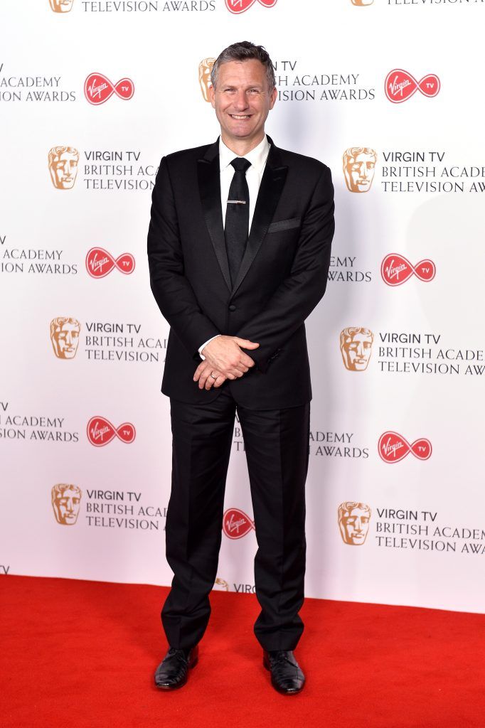 Adam Hills poses in the Winner's room at the Virgin TV BAFTA Television Awards at The Royal Festival Hall on May 14, 2017 in London, England.  (Photo by Jeff Spicer/Getty Images)