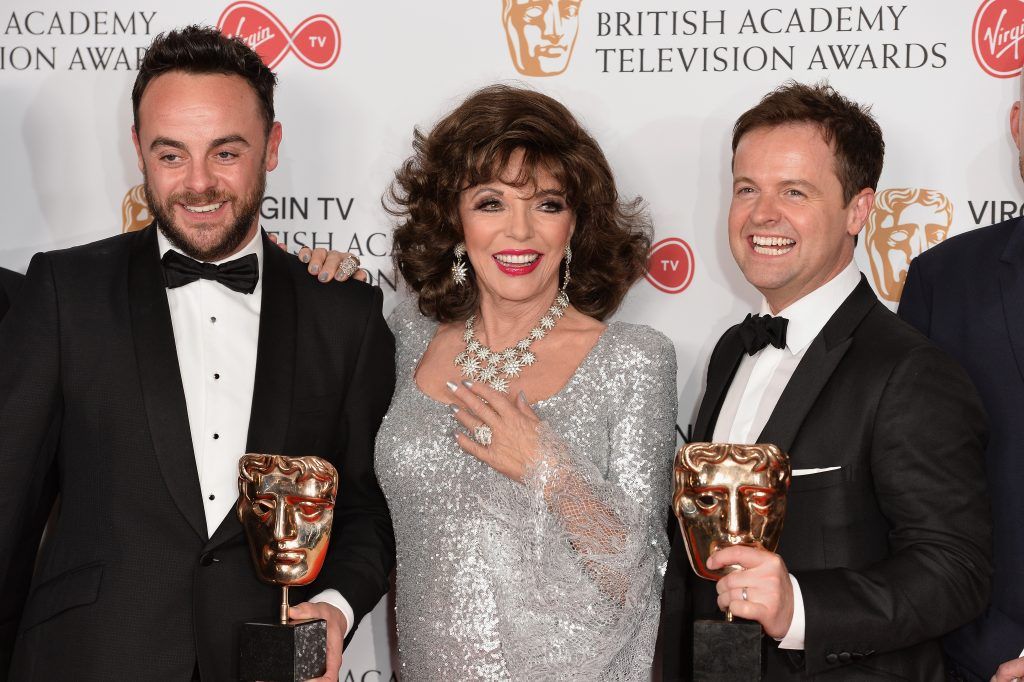 Dame Joan Collins (C) poses with Anthony McPartlin (L) and Declan Donnelly, winners of the Entertainment Programme award for 'Ant and Dec's Saturday Night Takeaway' in the Winner's room at the Virgin TV BAFTA Television Awards at The Royal Festival Hall on May 14, 2017 in London, England.  (Photo by Jeff Spicer/Getty Images)