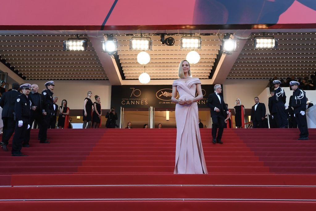 Uma Thurman poses as she arrives on May 17, 2017 for the screening of the film 'Ismael's Ghosts' (Les Fantomes d'Ismael) during the opening ceremony of the 70th edition of the Cannes Film Festival in Cannes, southern France. (Photo  ANNE-CHRISTINE POUJOULAT/AFP/Getty Images)