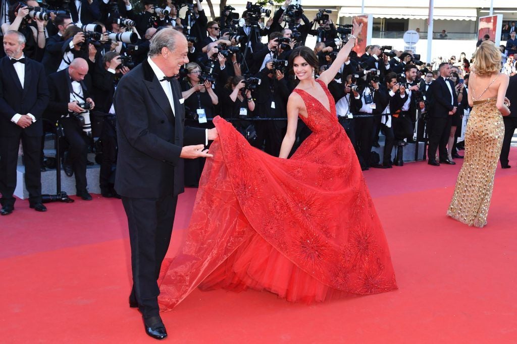 The president, owner and founder of de Grisogono Fawaz Gruosi (L) and Portuguese model Sara Sampaio pose as they arrive on May 17, 2017 for the screening of the film 'Ismael's Ghosts' (Les Fantomes d'Ismael) during the opening ceremony of the 70th edition of the Cannes Film Festival in Cannes, southern France.        (Photo ALBERTO PIZZOLI/AFP/Getty Images)