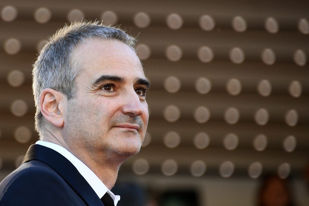 French director Olivier Assayas poses as she arrives on May 17, 2017 for the screening of the film 'Ismael's Ghosts' during the opening ceremony of the 70th edition of the Cannes Film Festival in Cannes, southern France.      (Photo ANNE-CHRISTINE POUJOULAT/AFP/Getty Images)