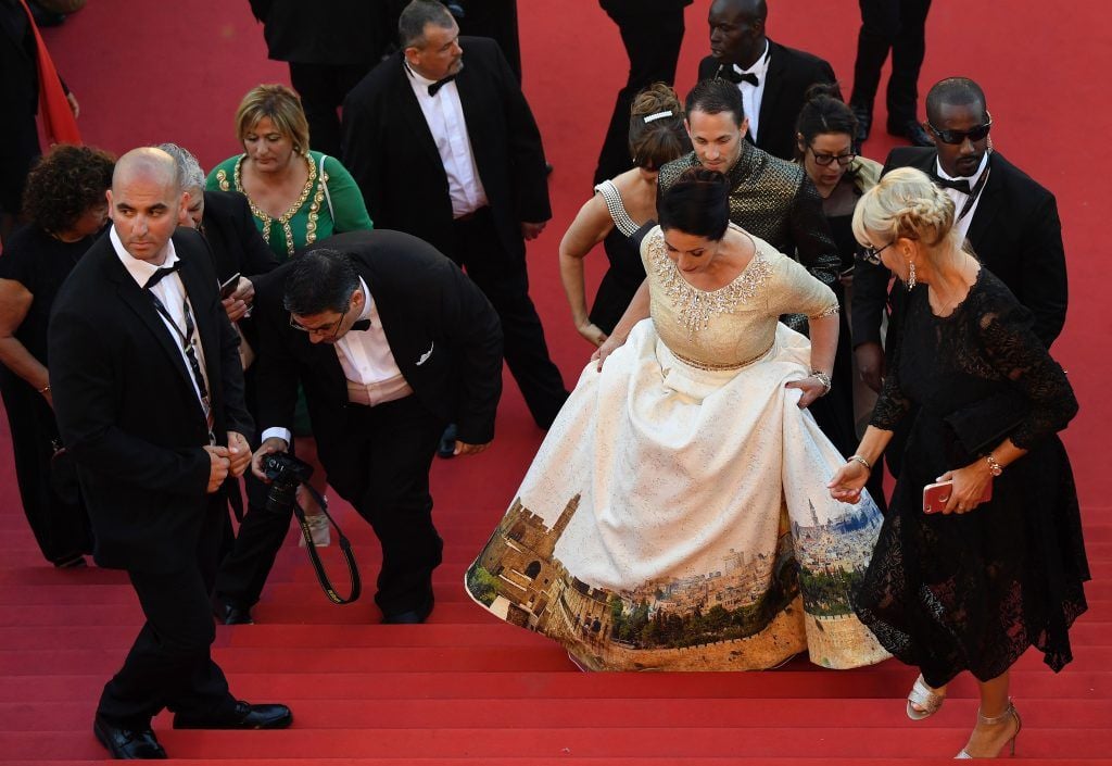 Israeli Culture Minister Miri Regev wearing a dress featuring the old city of Jerusalem arrives on May 17, 2017 for the screening of the film 'Ismael's Ghosts' (Les Fantomes d'Ismael) during the opening ceremony of the 70th edition of the Cannes Film Festival in Cannes, southern France. (Photo ANTONIN THUILLIER/AFP/Getty Images)