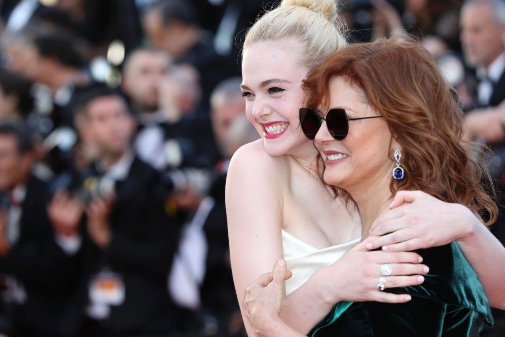 Elle Fanning (L) and Susan Sarandon pose as they arrive on May 17, 2017 for the screening of the film 'Ismael's Ghosts' (Les Fantomes d'Ismael) during the opening ceremony of the 70th edition of the Cannes Film Festival in Cannes, southern France.        (Photo VALERY HACHE/AFP/Getty Images)