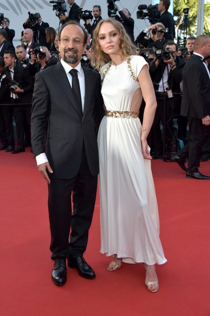 Director Asghar Farhadi and Lily-Rose Depp attend the "Ismael's Ghosts (Les Fantomes d'Ismael)" screening and Opening Gala during the 70th annual Cannes Film Festival at Palais des Festivals on May 17, 2017 in Cannes, France.  (Photo by Pascal Le Segretain/Getty Images)