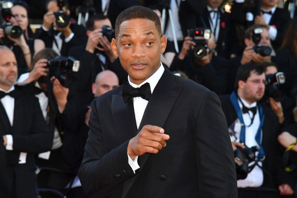 Will Smith poses as he arrives on May 17, 2017 for the screening of the film 'Ismael's Ghosts' (Les Fantomes d'Ismael) during the opening ceremony of the 70th edition of the Cannes Film Festival in Cannes, southern France. (Photo ALBERTO PIZZOLI/AFP/Getty Images)