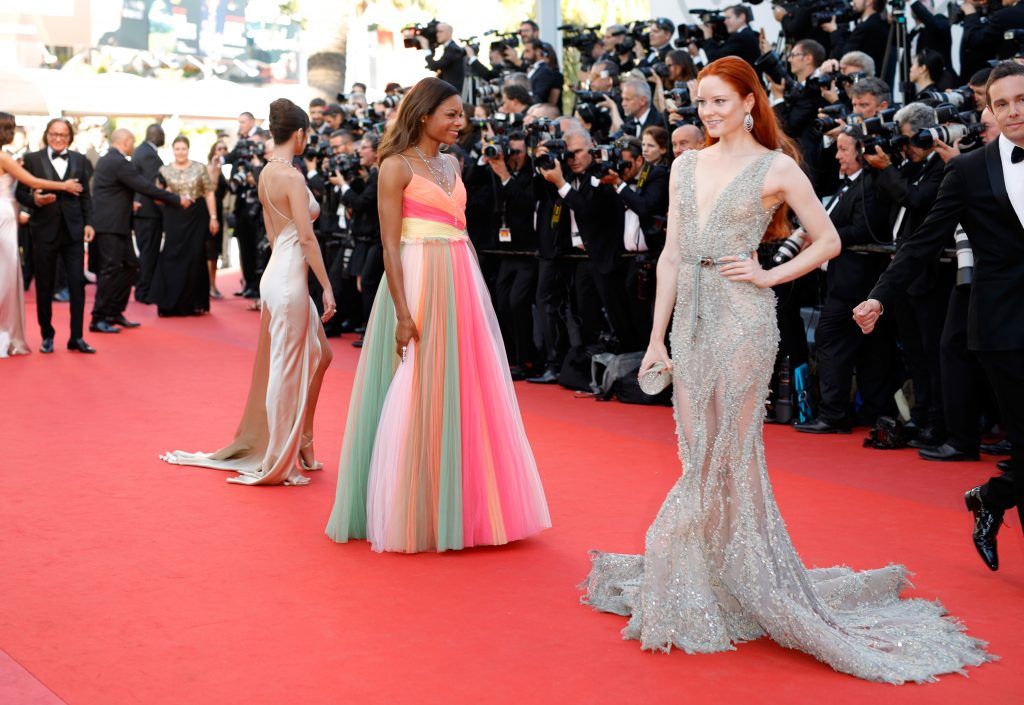 Actress Naomie Harris (C) and Barbara Meier (R) attend the "Ismael's Ghosts (Les Fantomes d'Ismael)" screening and Opening Gala during the 70th annual Cannes Film Festival at Palais des Festivals on May 17, 2017 in Cannes, France.  (Photo by Andreas Rentz/Getty Images)