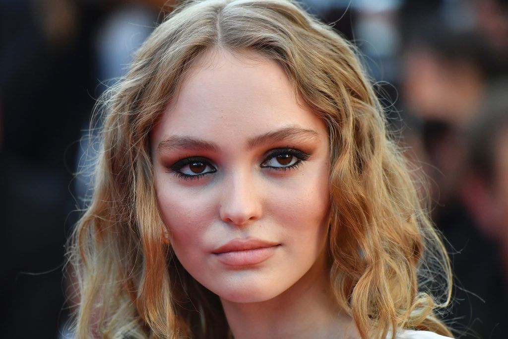 Lily-Rose Depp poses as she arrives on May 17, 2017 for the screening of the film 'Ismael's Ghosts' (Les Fantomes d'Ismael) during the opening ceremony of the 70th edition of the Cannes Film Festival in Cannes, southern France.  (Photo ALBERTO PIZZOLI/AFP/Getty Images)