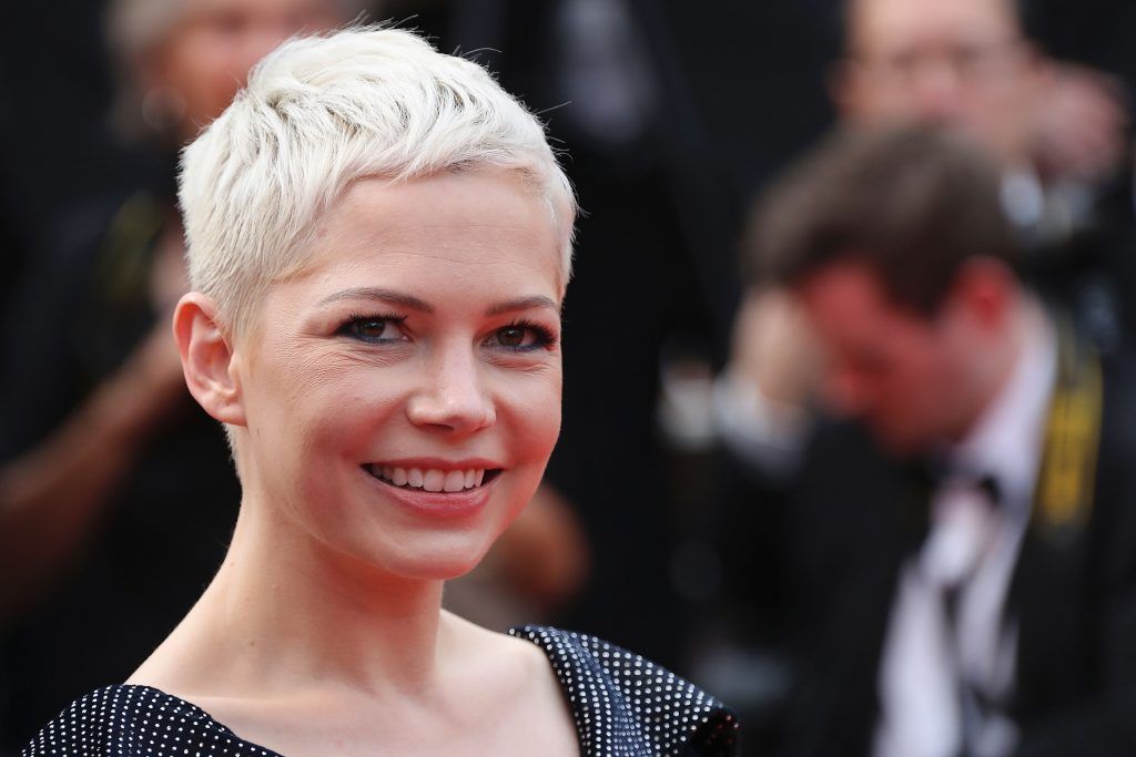 Michelle Williams smiles as she leaves on May 18, 2017 the Festival Palace after the screening of the film 'Wonderstruck' at the 70th edition of the Cannes Film Festival in Cannes, southern France. (Photo VALERY HACHE/AFP/Getty Images)