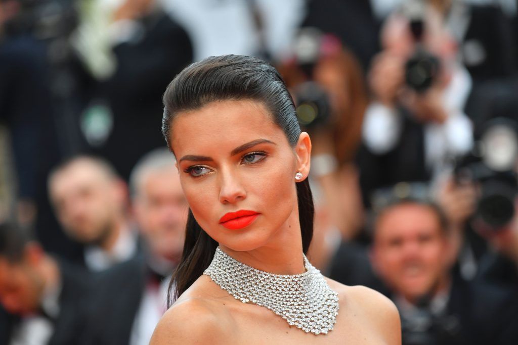 Brazilian model  Adriana Lima poses as she arrives on May 18, 2017 for the screening of the film 'Loveless' (Nelyubov) at the 70th edition of the Cannes Film Festival in Cannes, southern France.  (Photo LOIC VENANCE/AFP/Getty Images)