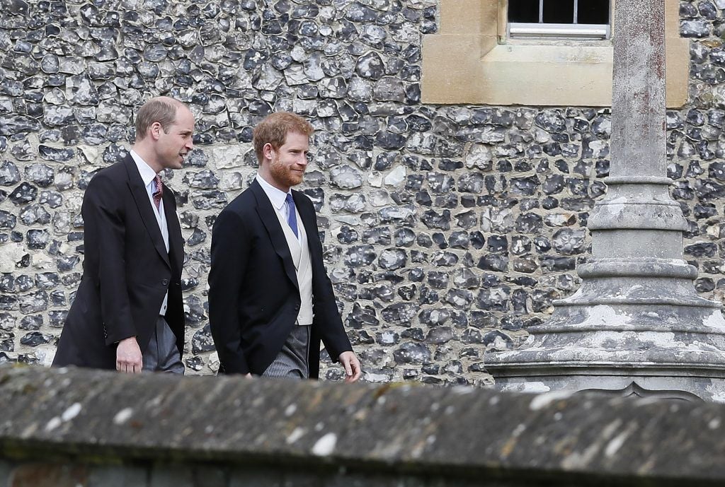 Britain's Prince William, left, and his brother Prince Harry arrive for the wedding of Pippa Middleton and James Matthews at St Mark's Church on May 20, 2017 in Englefield.(Photo by Kirsty Wigglesworth - Pool/Getty Images)