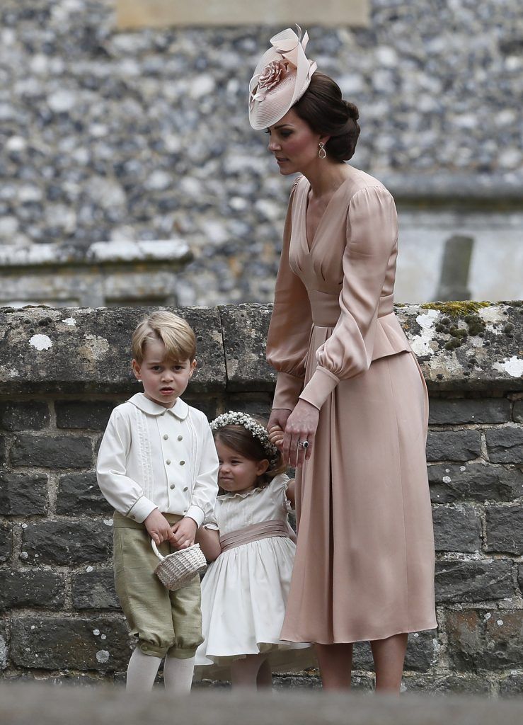 Catherine, Duchess of Cambridge, right, stands with Princess Charlotte and Prince George, who were flower boys and girls at the wedding of Pippa Middleton and James Matthews at St Mark's Church on May 20, 2017 in in Englefield, England. (Photo by Kirsty Wigglesworth - Pool/Getty Images)