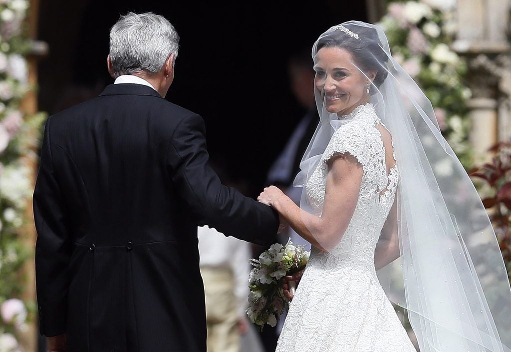 Pippa Middleton arrives with her father Michael Middleton for her wedding to James Matthews at St Mark's Churchon May 20, 2017 in Englefield, England. (Photo by Kirsty Wigglesworth - Pool/Getty Images)