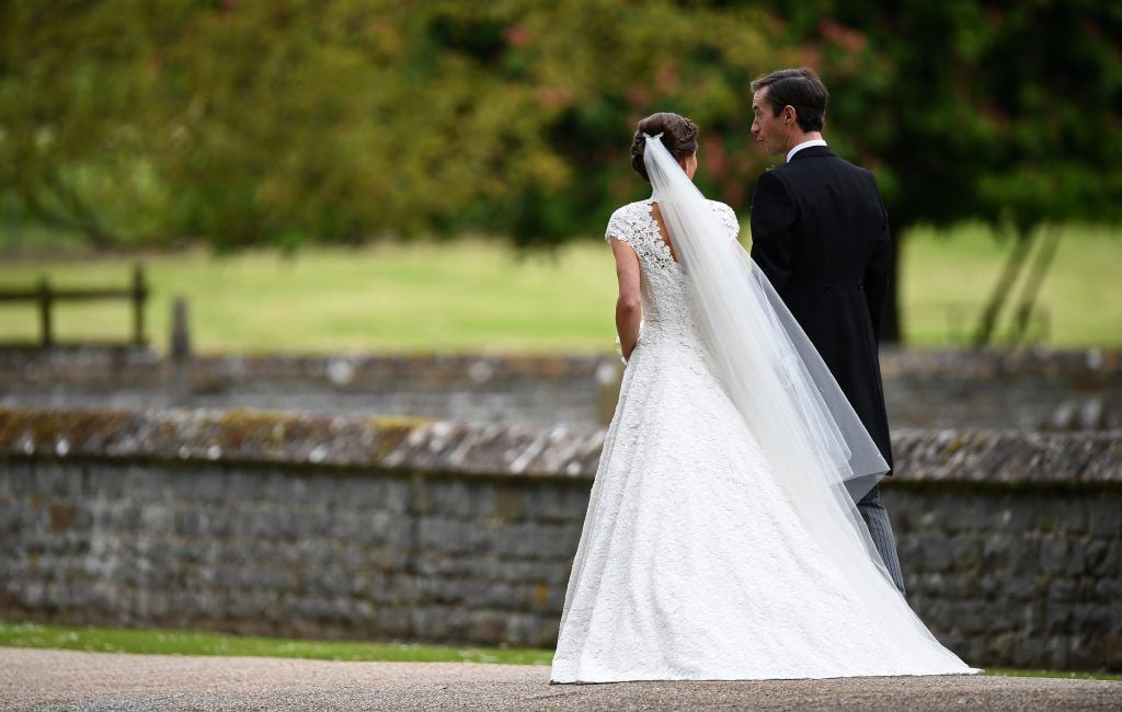 Pippa Middleton and her new husband James Matthews leave church following their wedding ceremony at St Mark's Church as the bridesmaids and pageboys walk ahead on May 20, 2017 in Englefield Green, England.  (Photo by Justin Tallis - WPA Pool/Getty Images)