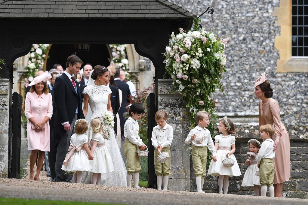 Pippa Middleton and her new husband James Matthews are seen with Catherine, Duchess of Cambridge and her children Prince George of Cambridge and Princess Charlotte of Cambridge leave church following their wedding ceremony at St Mark's Church as the bridesmaids and pageboys walk ahead on May 20, 2017 in Englefield Green, England.  (Photo by Justin Tallis - WPA Pool/Getty Images)