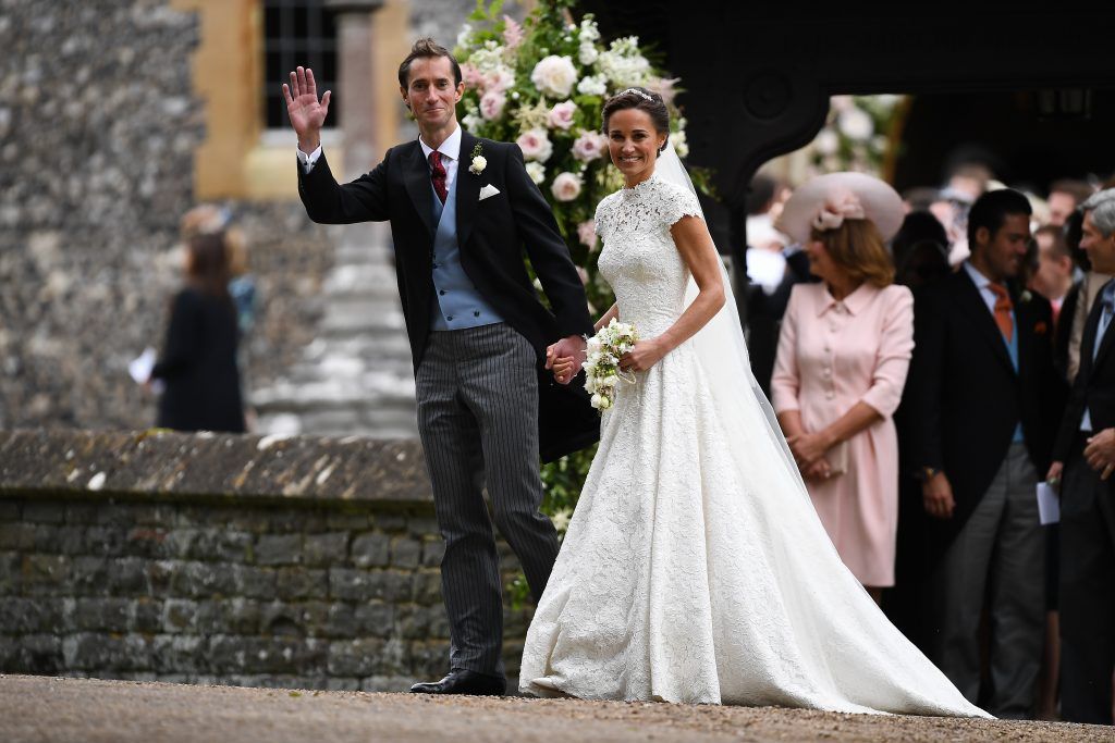 Pippa Middleton and her new husband James Matthews leave church following their wedding ceremony at St Mark's Church as the bridesmaids and pageboys walk ahead on May 20, 2017 in Englefield Green, England.  (Photo by Justin Tallis - WPA Pool/Getty Images)