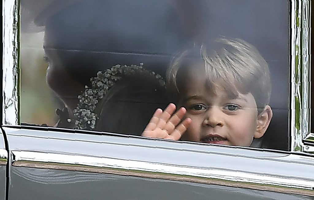 Britain's Prince George waves as he leaves in a car after attending the wedding of his aunt, Pippa Middleton, to James Matthews at St Mark's Church in Englefield, west of London, on May 20, 2017. (Photo by JUSTIN TALLIS/AFP/Getty Images)
