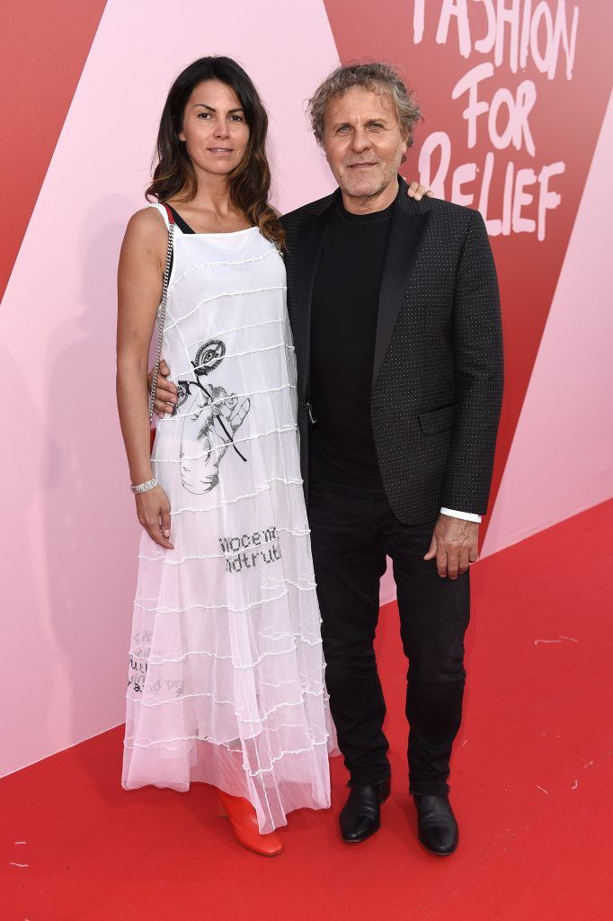 Renzo Rosso and Arianna Alessi (L) attend the Fashion for Relief event during the 70th annual Cannes Film Festival at Aeroport Cannes Mandelieu on May 21, 2017 in Cannes, France.  (Photo by Antony Jones/Getty Images)