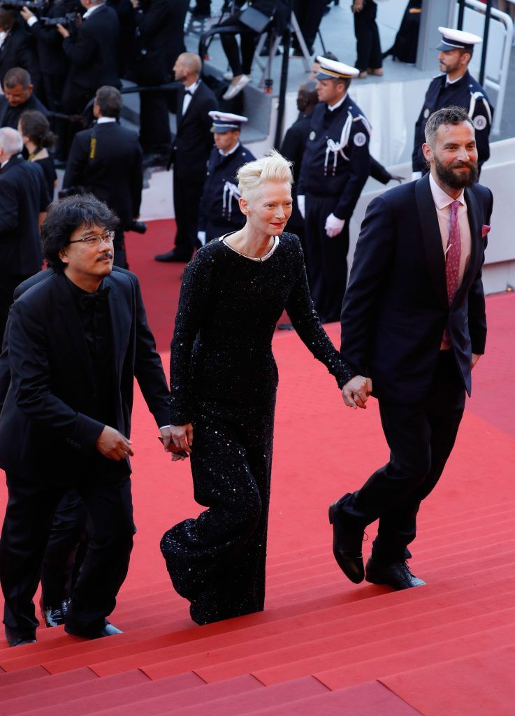 (L-R)  Bong Joon-ho, Tilda Swinton and Sandro Kopp attend the 70th Anniversary of the 70th annual Cannes Film Festival at Palais des Festivals on May 23, 2017 in Cannes, France.  (Photo by Andreas Rentz/Getty Images)