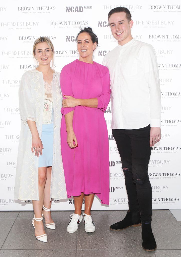 Shelly Corkery with student winner of the Brown Thomas bursary award Laoise Carey  and runner up  Colin Burke. They are pictured after at the National College of Arts and Design (NCAD)’s annual fashion show Photo: Leon Farrell/Photocall Ireland