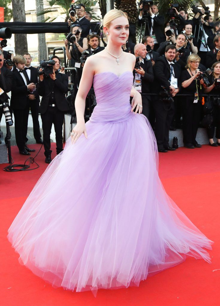 US actress Elle Fanning poses as she arrives on May 24, 2017 for the screening of the film 'The Beguiled' at the 70th edition of the Cannes Film Festival in Cannes, southern France.  (Photo by VALERY HACHE/AFP/Getty Images)