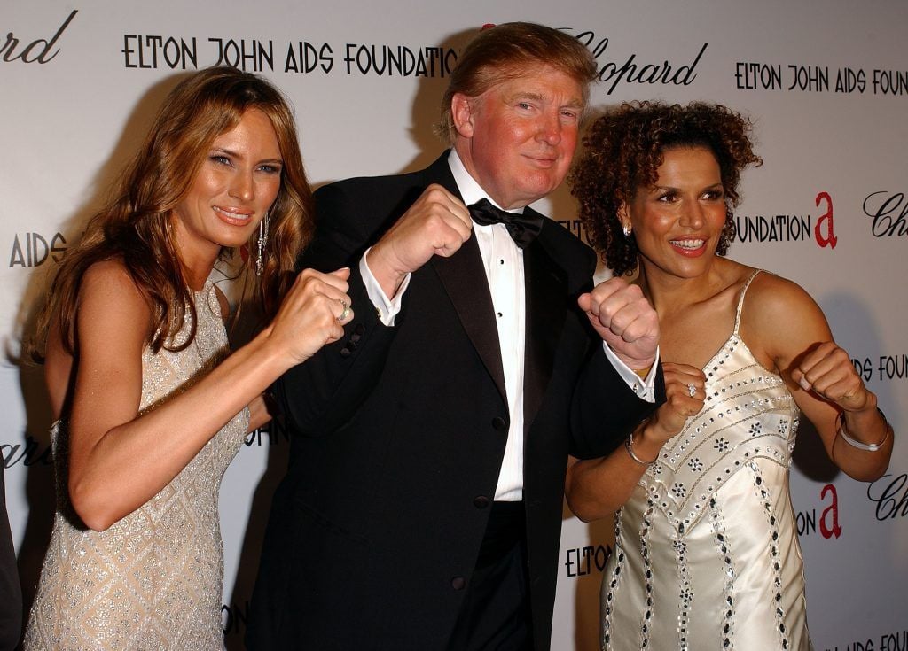 Melania Trump with husband Donald Trump and actress Lucia Rijker arrives at the 13th Annual Elton John Aids Foundation Academy Awards Viewing Party at the Pacific Design Center on February 27, 2005 in Los Angeles, California.  (Photo by Stephen Shugerman/Getty Images)