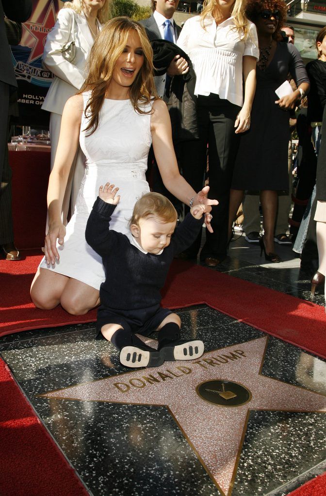 Donald Trump's wife Melania Trump and son Baron attend the ceremony honoring him with a star on the Hollywood Walk of Fame on January 16, 2006 in Hollywood, California. (Photo by Vince Bucci/Getty Images)