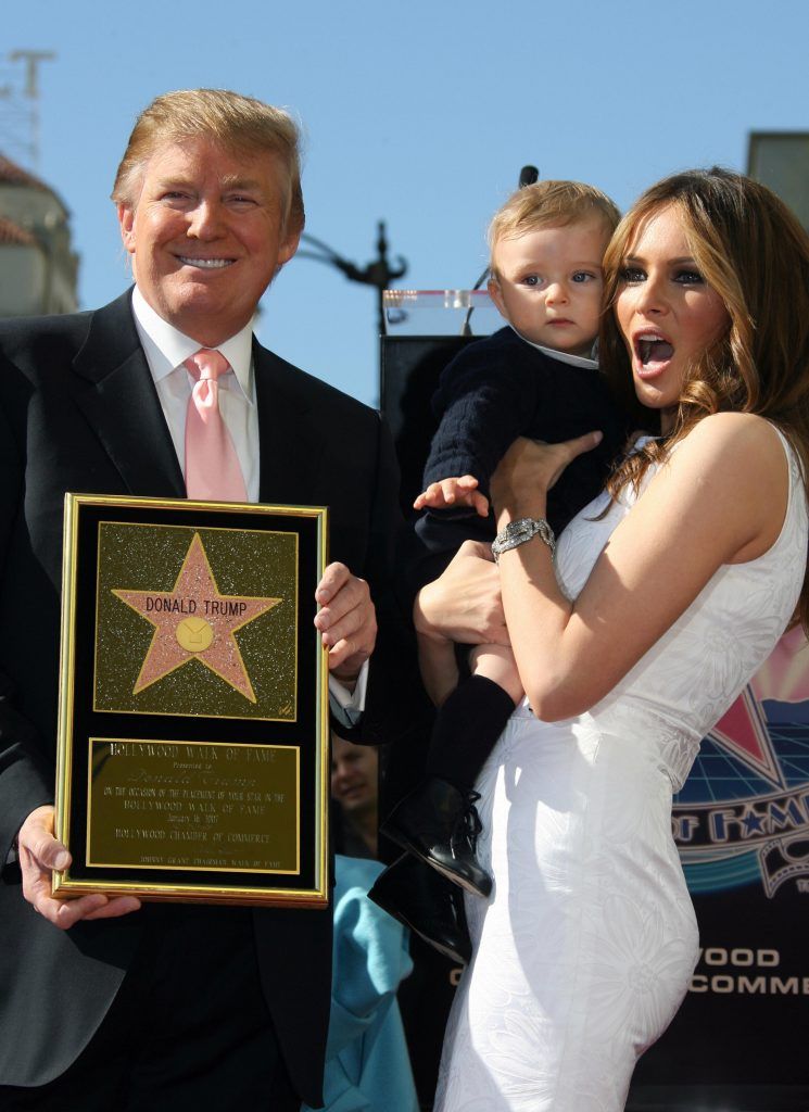 Donald Trump (L) poses with his wife Melania and their 10-month-old son Barron after he was honored by the 2,327th star on the Hollywood Walk of Fame on Hollywood Boulevard in Hollywood, CA, 16 January 2007.   (Photo by GABRIEL BOUYS/AFP/Getty Images)