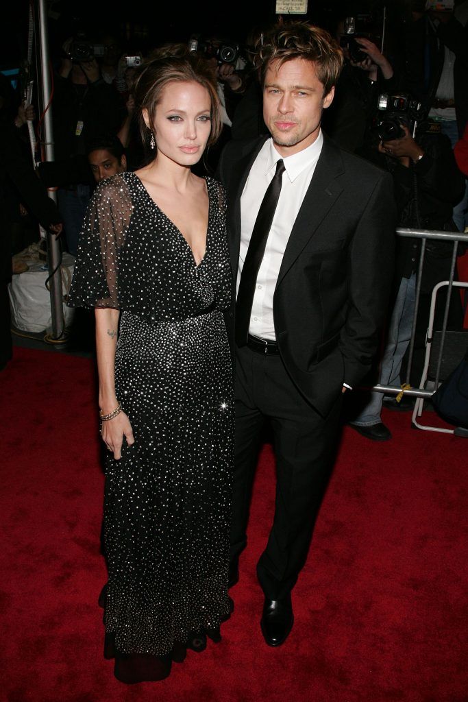 Angelina Jolie and Brad Pitt's first red carpet appearance as a couple was at 'The Good Shepherd' premiere, after Brad had officially split from Jennifer Aniston. (Photo by Bryan Bedder/Getty Images)