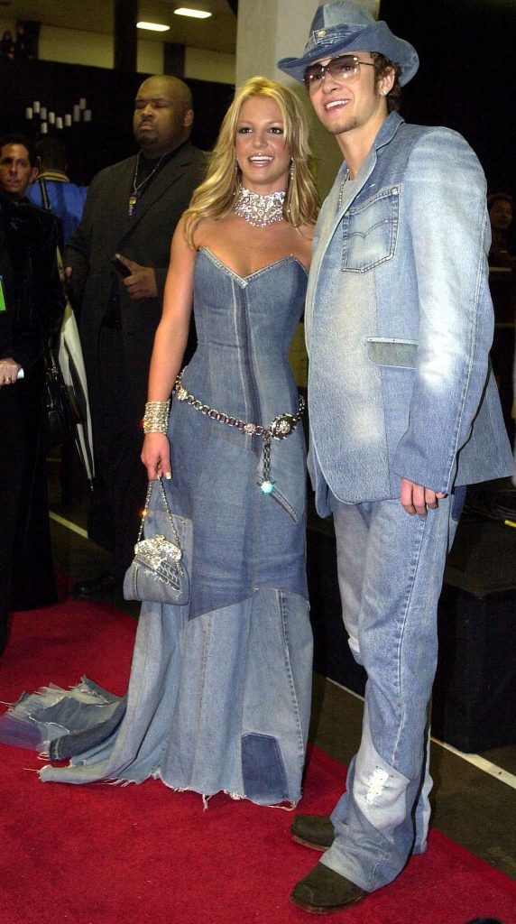 Britney Spears and her then boyfriend Justin Timberlake proved their love by having one of the most famous red carpet looks of all time at the Annual American Music Awards in 2001 (Photo by Lucy Nicholson/AFP/Getty Images)