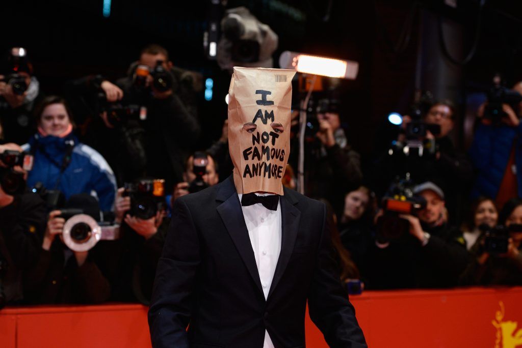Shia LaBeouf wore a paper bag claiming that 'I am not famous anymore' at the Berlin Film Festival 2014...He's still famous. (Photo by Clemens Bilan/Getty Images)