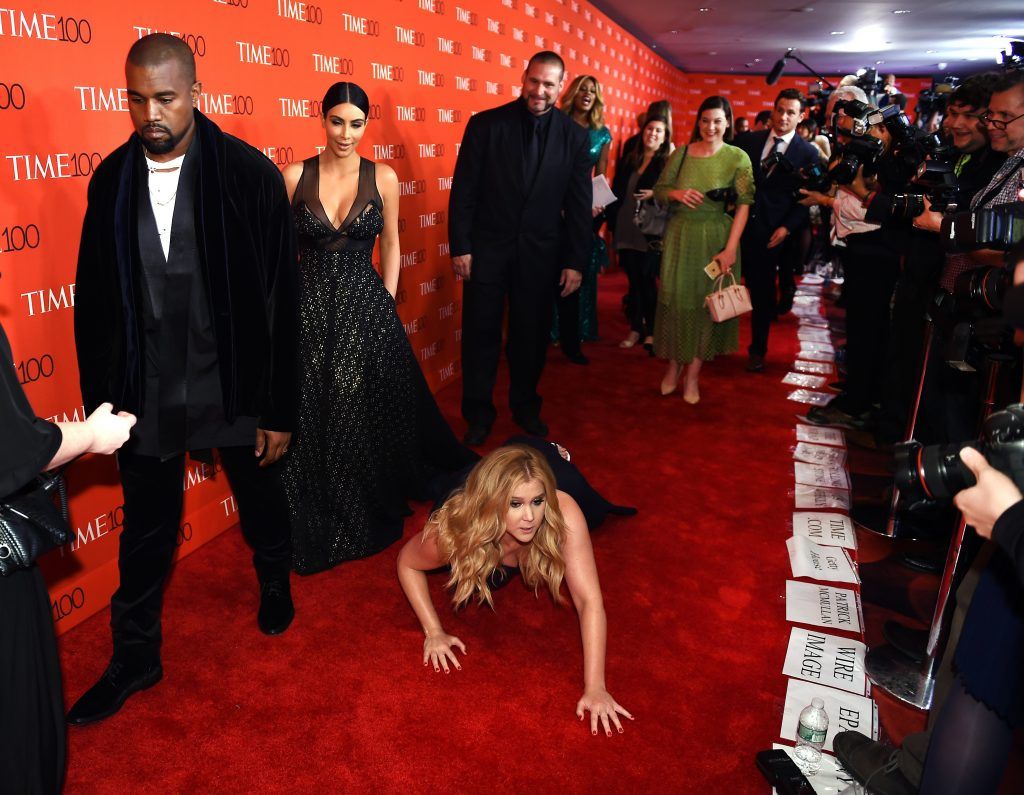 Amy Schumer pretended to fall in front Kim and Kanye at the Time 100 Gala in 2015 because no one knew who she was and she was tired of people looking over her shoulder. (Photo by Timothy A Clary/AFP/Getty Images)