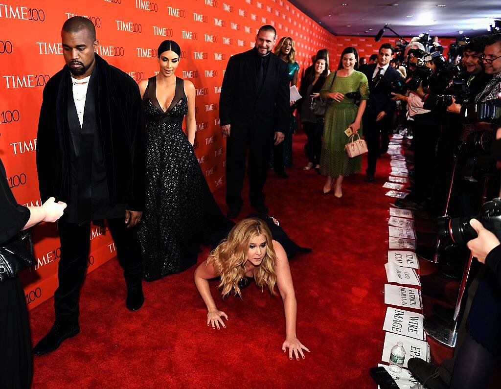 Amy Schumer pretended to fall in front Kim and Kanye at the Time 100 Gala in 2015 because no one knew who she was and she was tired of people looking over her shoulder. (Photo by Timothy A Clary/AFP/Getty Images)