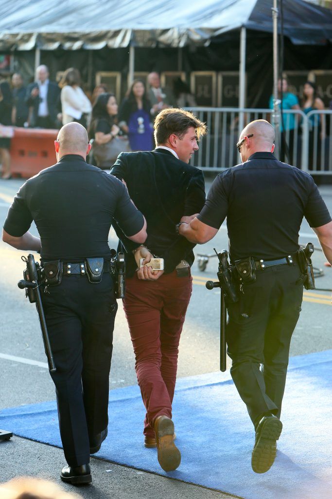 Red carpet prankster Vitalii Sediuk buried his face in Bradd Pitt's crotch at the Maleficent premiere in 2014 and was arrested by police. is led away by police following an altercation with Brad Pitt, during which the Hollywood actor was reported to have been struck in the face. (Photo by Michael Wright/WENN.com)