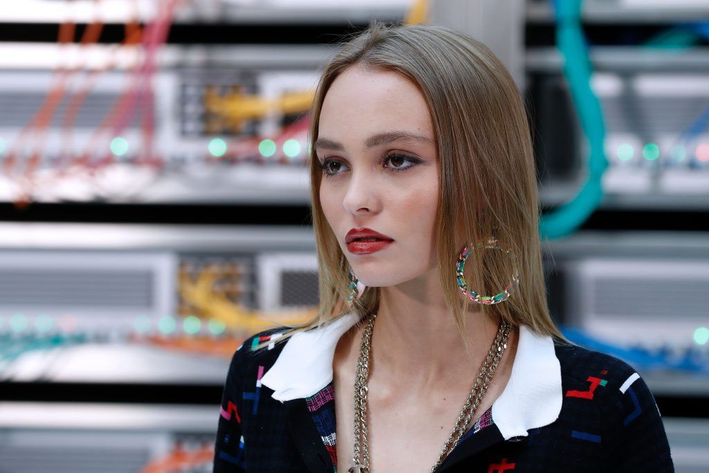 Lily-Rose Depp poses before the Chanel 2017 Spring/Summer ready-to-wear collection fashion show, on October 4, 2016 in Paris. (Photo by FRANCOIS GUILLOT/AFP/Getty Images)