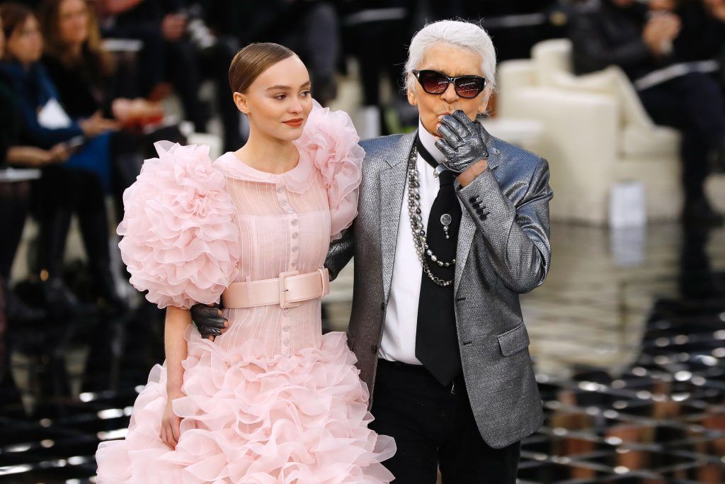 Karl Lagerfeld and Lily-Rose Depp at the end of the Chanel during the 2017 spring/summer Haute Couture collection on January 24, 2017 at the Grand Palais in Paris. (Photo by PATRICK KOVARIK/AFP/Getty Images)