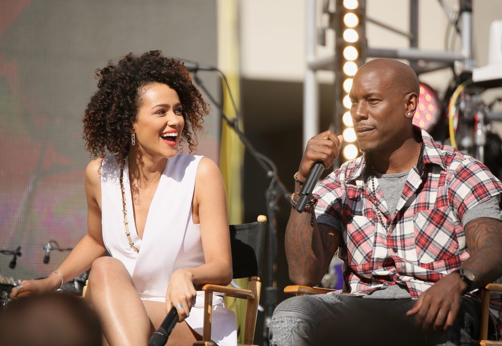 Nathalie Emmanuel (L) and recording artist/actor Tyrese speak ontage during an exclusive "Furious 7" concert hosted by REVOLT Live at Hollywood Studio at Hollywood and Highland on April 1, 2015 in Hollywood, California.  (Photo by Mike Windle/Getty Images for Revolt TV)