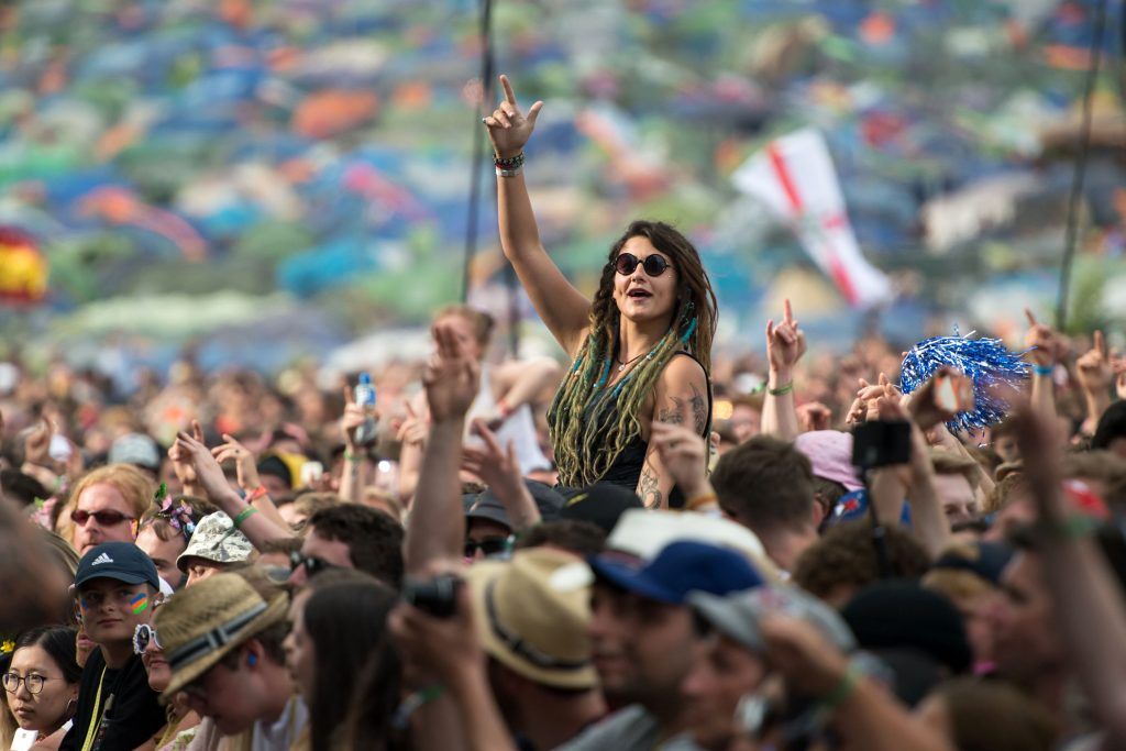 Music fans watch Royal Blood perform on the Pyramid Stage at the Glastonbury Festival of Music and Performing Arts on Worthy Farm near the village of Pilton in Somerset, south-west England on June 23, 2017.      (Photo by OLI SCARFF/AFP/Getty Images)