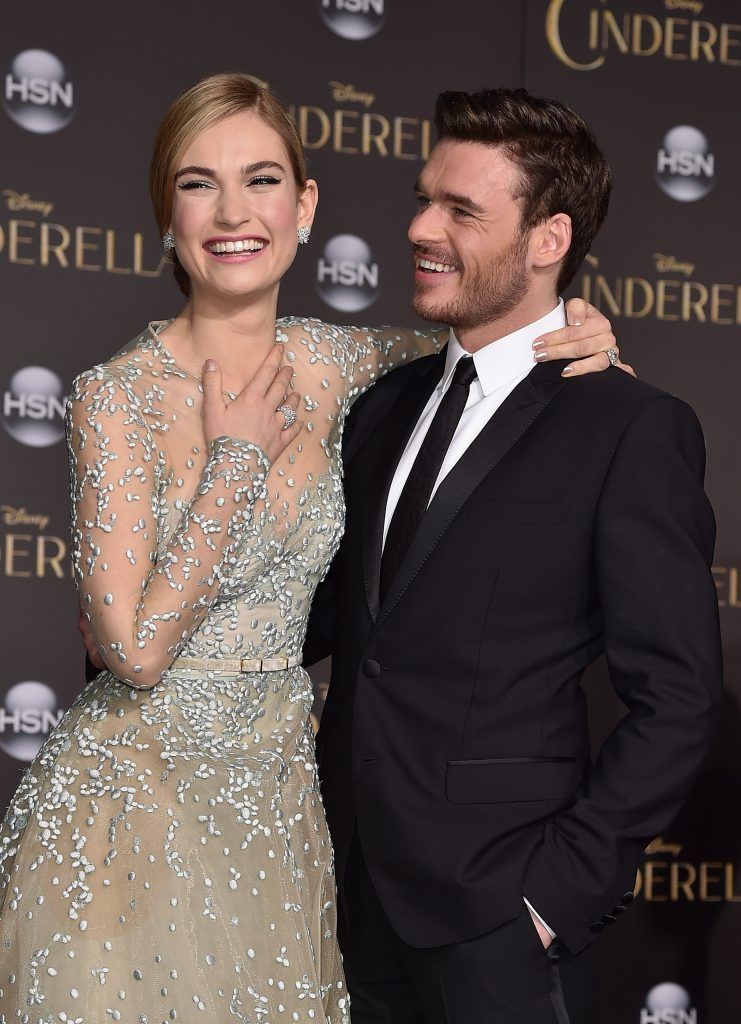 Actors Lily James (L) and Richard Madden attend the premiere of Disney's "Cinderella" at the El Capitan Theatre on March 1, 2015 in Hollywood, California.  (Photo by Kevin Winter/Getty Images)