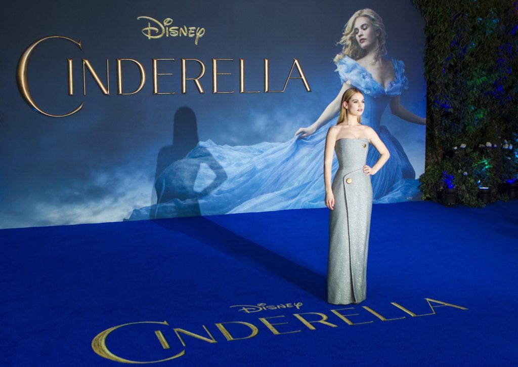 British actress Lily James poses for photographers on the red carpet ahead of the UK premiere of the film 'Cinderella' in central London on March 19, 2015. (Photo by JACK TAYLOR/AFP/Getty Images)